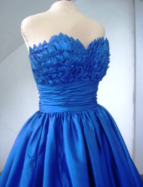 Alluring intricate, 50s inspired ball dress with beautiful bust detail inspired by blooming petals