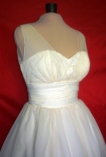 A beautifully elegant off-white 50s inspired wedding dress