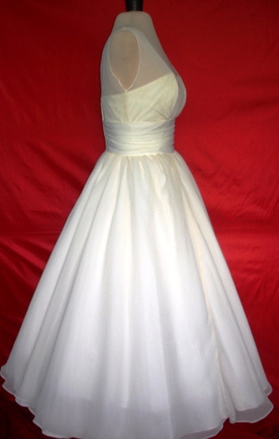 A beautifully elegant off-white 50s inspired wedding dress