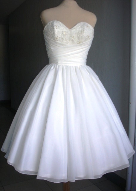 Elegant Ivory chiffon wedding dress, with corset top and wrapped bust design