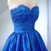 Alluring intricate, 50s inspired ball dress with beautiful bust detail inspired by blooming petals