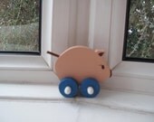 Small pig on wheels