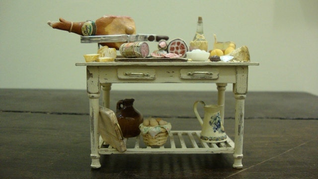 Miniature table  shabby chic set up with salami and typical Italian products
