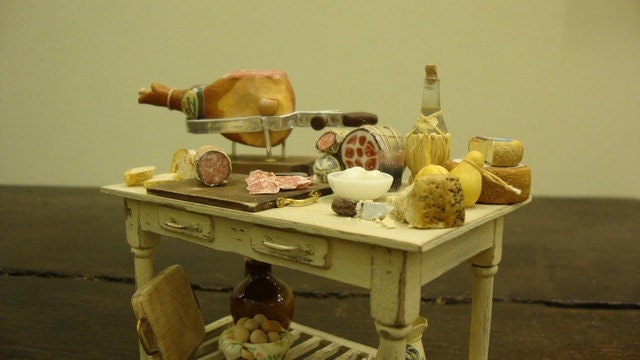 Miniature table  shabby chic set up with salami and typical Italian products