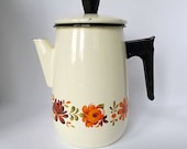Vintage French enamel coffee pot in cream with floral motif and stay cool handle