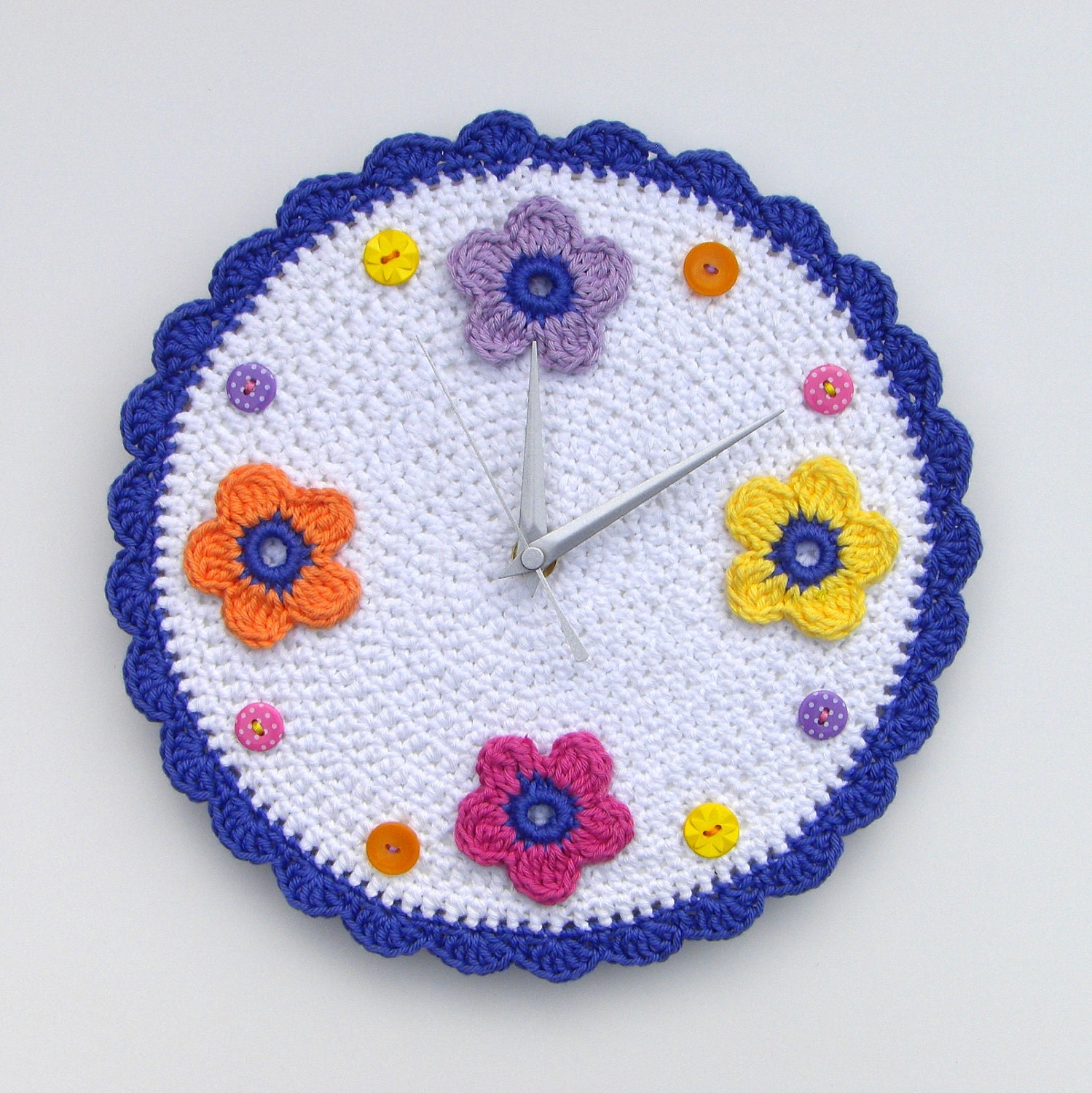 Crochet wall clock with bright flowers and buttons