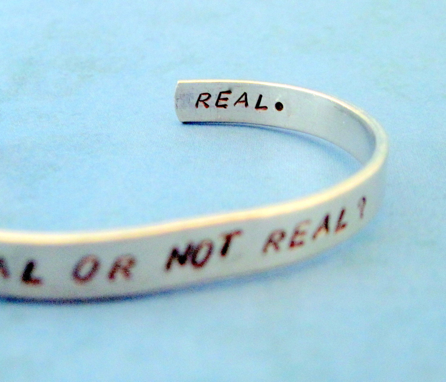 Hunger Games Inspired Bracelet - Real or Not Real - 2-Sided Hand Stamped Aluminum Cuff - customizable