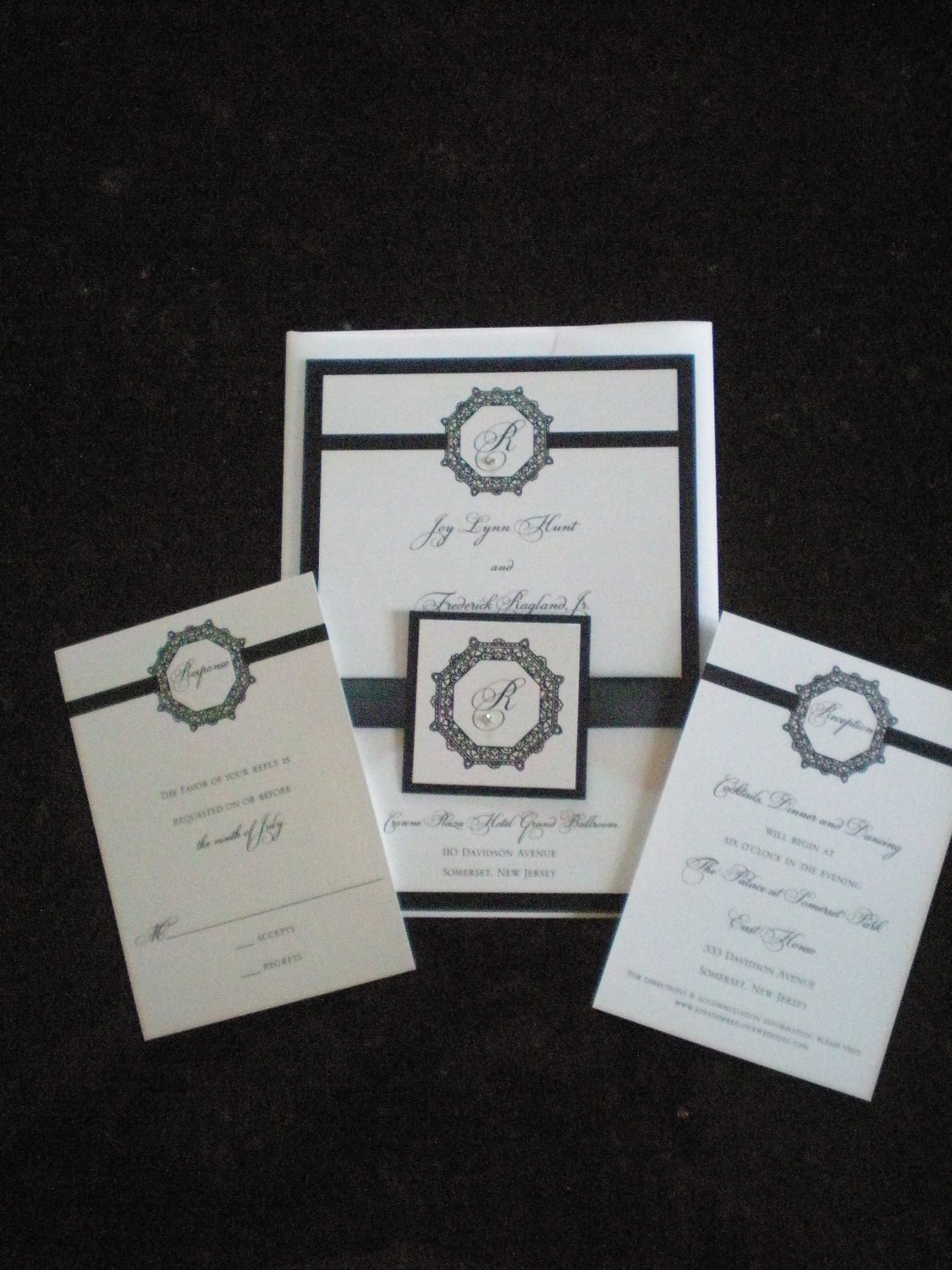 Elegant, Simple Black and White Invitation with an Embellished Monogram/Ribbon Wrap