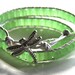 Leather wrap bracelet made with pearl colored leather, lime green cube crystals and silver dragonfly button clasp