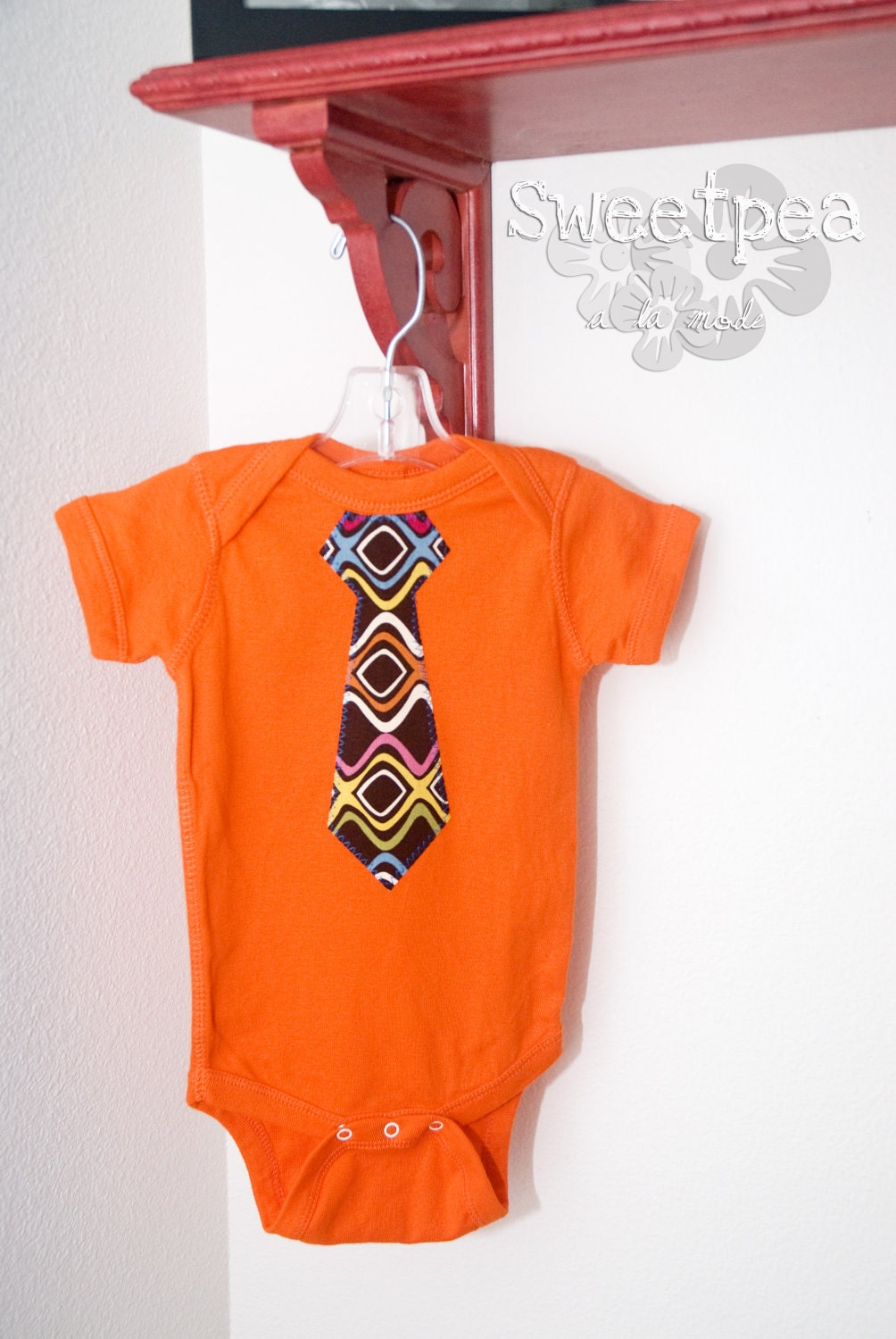 The Holden - 6M orange romper with mod brown/multicolor tie
