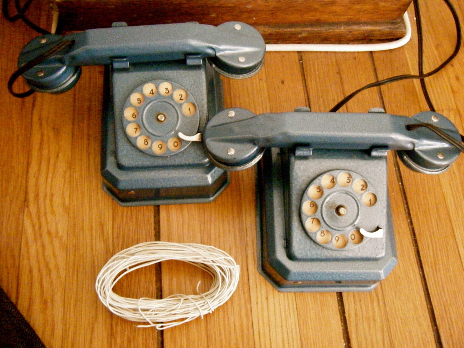 Two vintage 1950s walkie talkie metal children's toy phones
