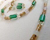 Jewelry set with art glass, rose quartz, citrine, and jade necklace, bracelet, and earrings.