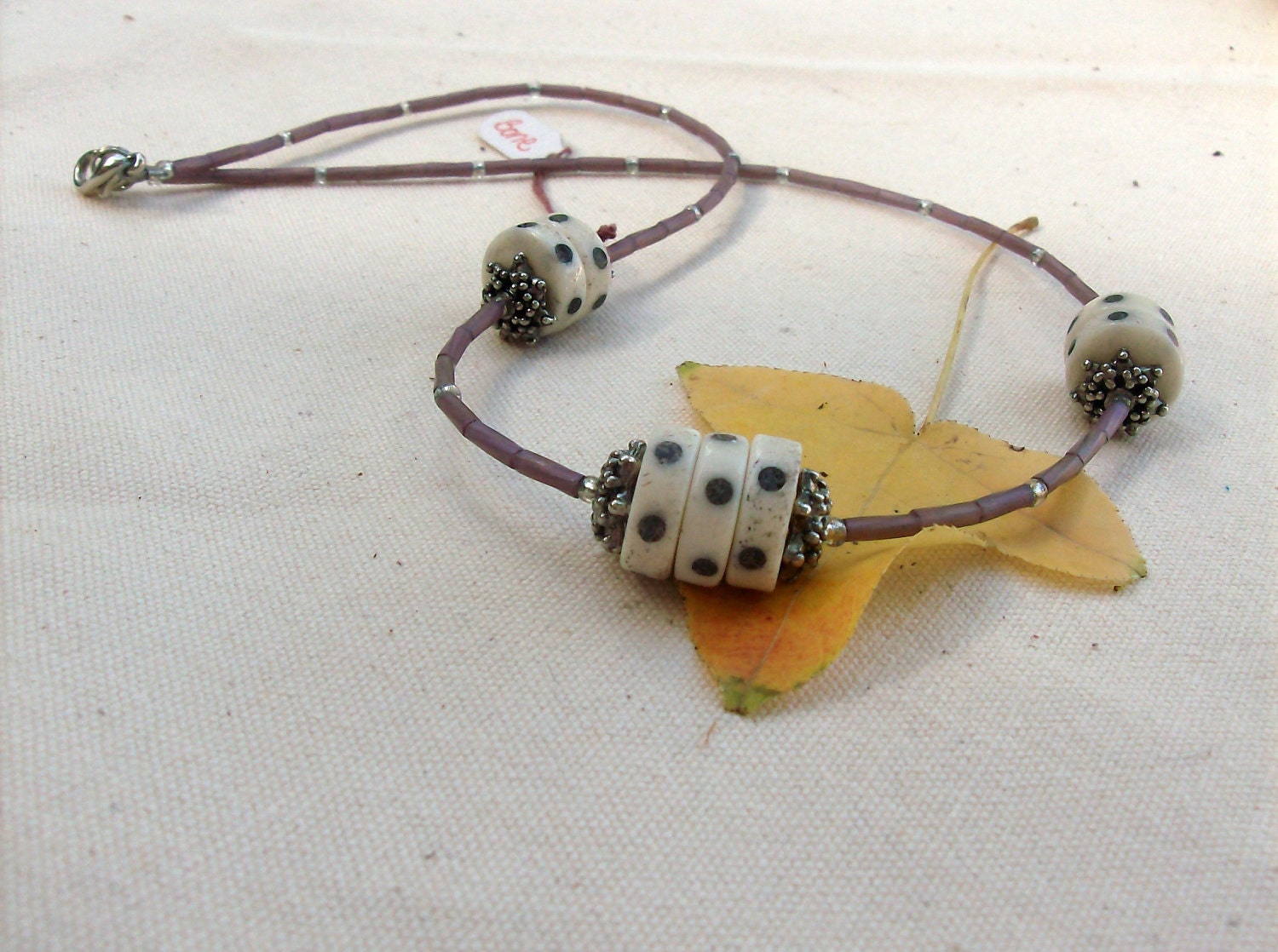 Purple necklace with bone beads