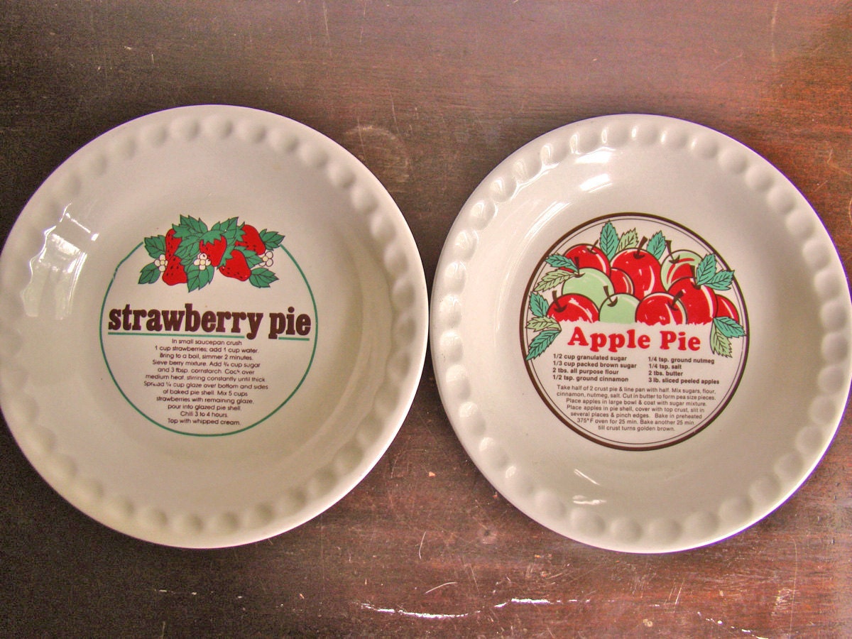 vintage pair of ceramic pie recipe plates: apple and strawberry pie