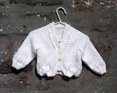 Hand knitted baby girls cream cardigan with fancy edge. 16" chest.