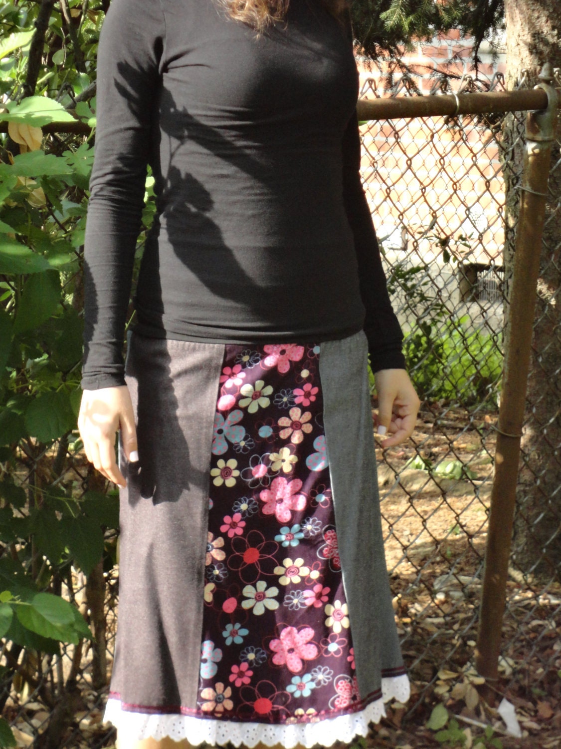 knee-length 3 panel skirt with purple floral design.