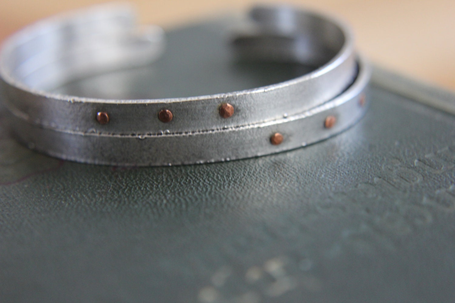 single sterling silver cuff bracelet with copper rivets--textured, delicate, fierce