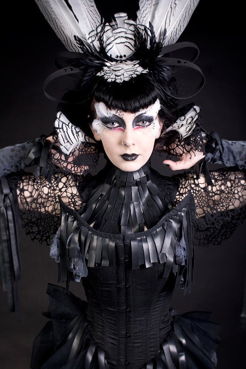 Feather and latex neck corset.