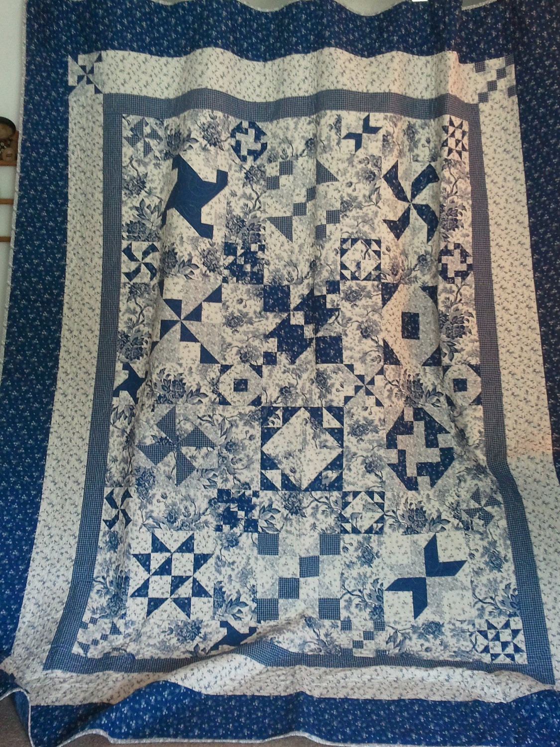 Blue and White Floral Print Quilt