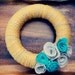Yarn Wreath with Dimensional Felt Flowers. Mustard Yellow Yarn with Grey and Teal Flowers by Catshy Crafts