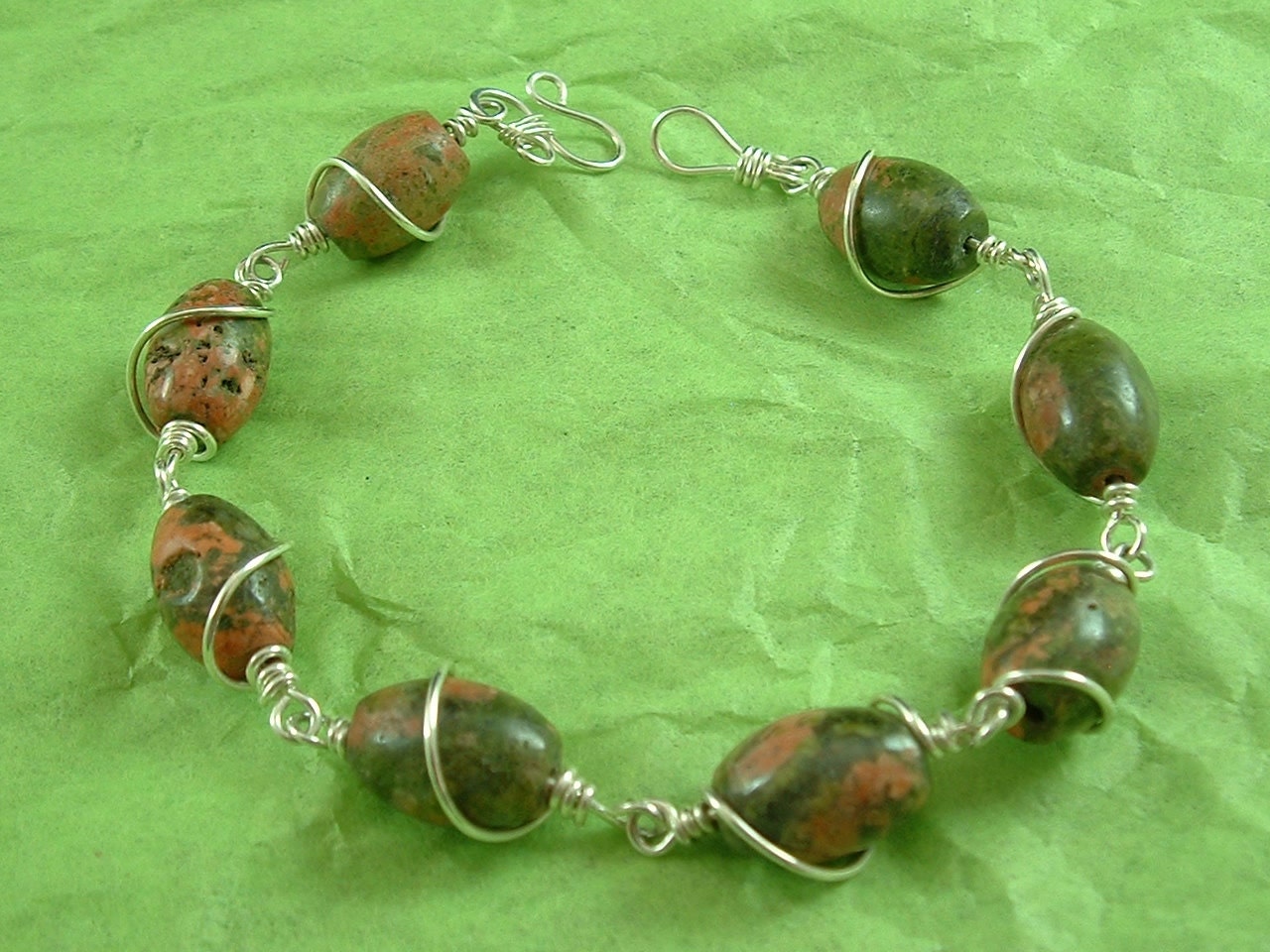 8 1/2 " Bracelet, pink and green Unikite with sterling silver wire wrapping....10-BSG-066