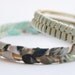 Fabric bracelet. Pastel fabric hand braided with antique copper metal rings.Mint, rose, blue and green colors. Medium size
