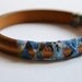 Wood and fabric bangle. Summer tribal fabric hand knotted around wooden bangle. Blue/green color. Light weight Small size.