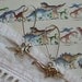 Dinosaur Earrings - Dino Dangle Earrings in Silver - Brontosaurus and Tyrannosaurus Rex / T Rex