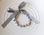 Pearl and ribbon tie bracelet