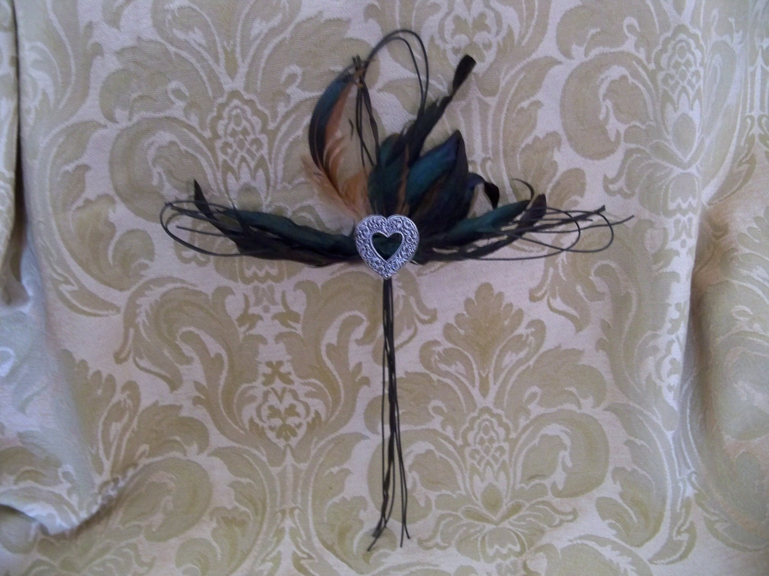 Wire cross with feathers and heart