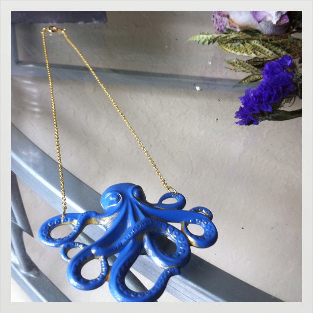 Royal Blue Faux Patina Brass Octopus Pendant on a gold finished brass chain
