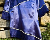 Blue asymmetric top with fancy lace.