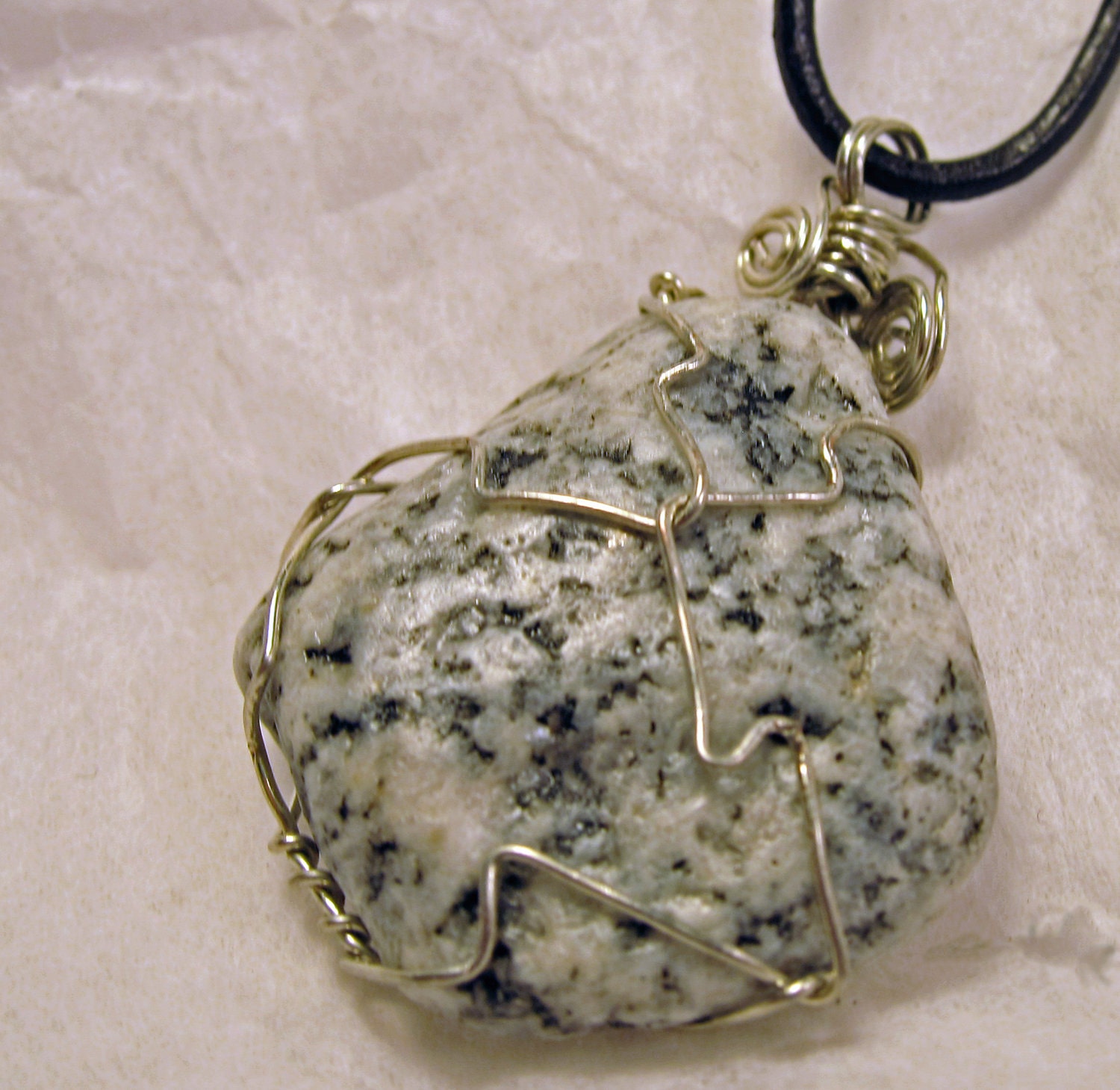 wire wrapped black and white spotted beach stone pendant necklace