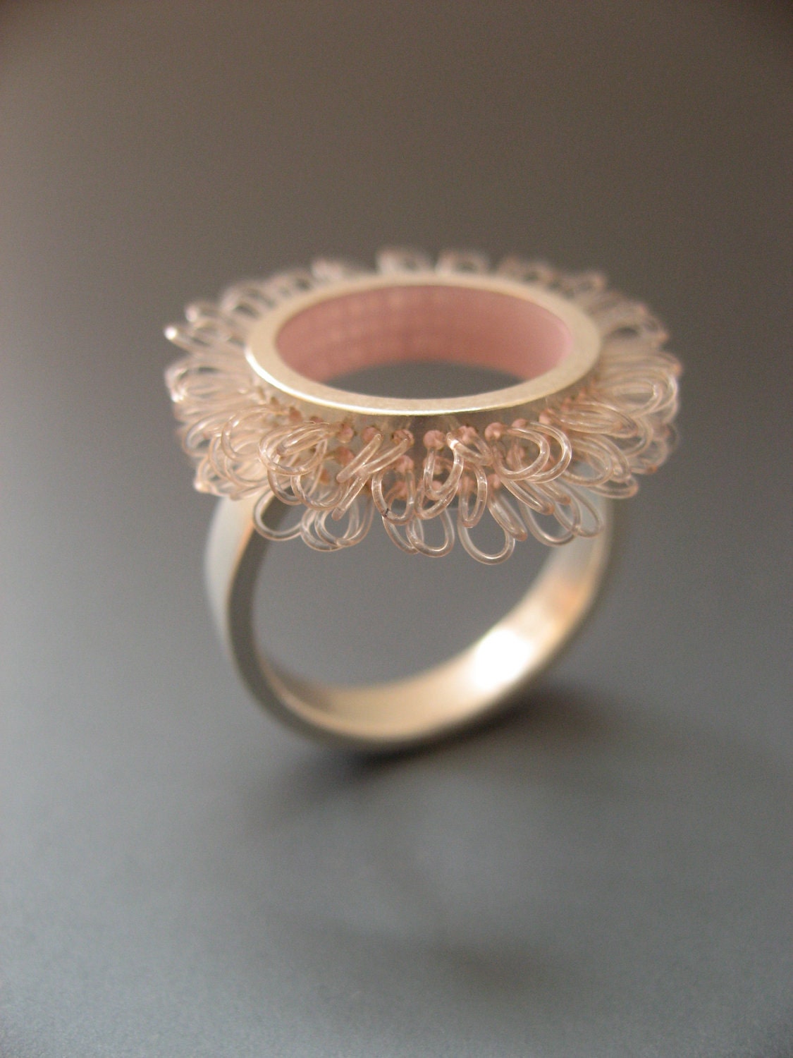 Ring sterling silver and plastic, Diameter of ring top 21mm, color rose pink, design "loops in circles"