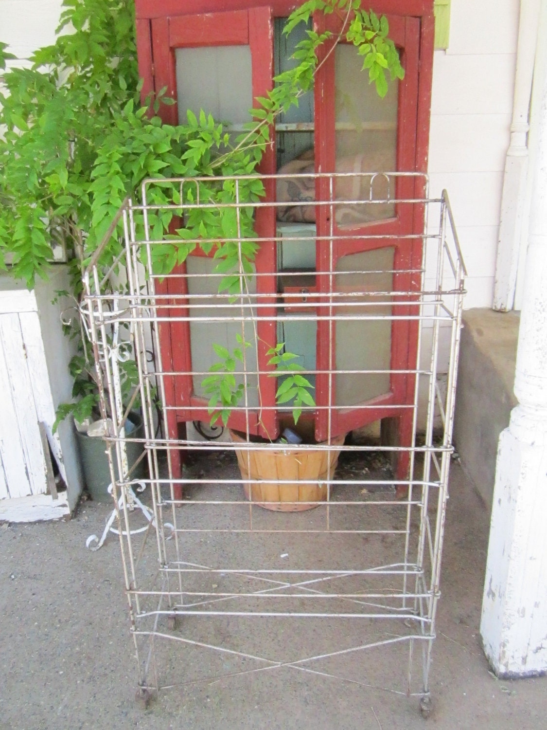 Vintage industrial metal bread  market rack with castors