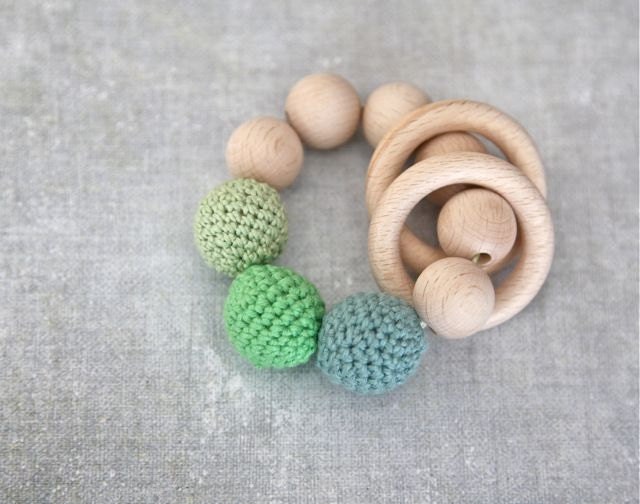 Teething toy with crochet green, mint, light pale green wooden beads and 2 wooden rings. Wooden rattle. Teething ring
