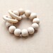 Teething ring toy with wooden beads and 2 wooden rings. Neutral waldorf wooden beads rattle.