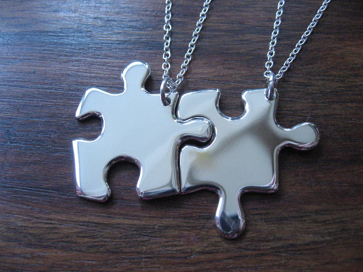Two Silver Puzzle Piece Pendants