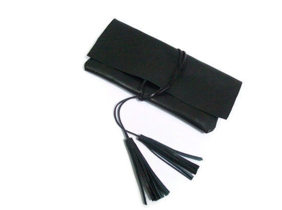 Black leather clutch with tassels