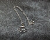 Silver Tone Knuckle Duster Necklace