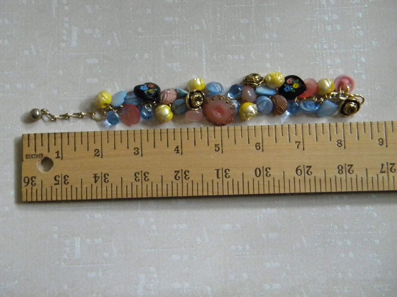 Vintage button bracelet glass, metal and plastic buttons in pink, yellow, blue and black hearts and flowers