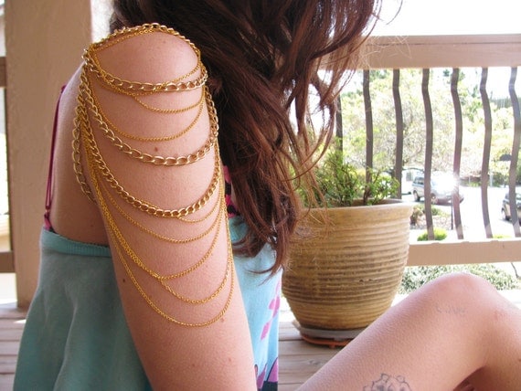 Gold mutli chain arm chain
