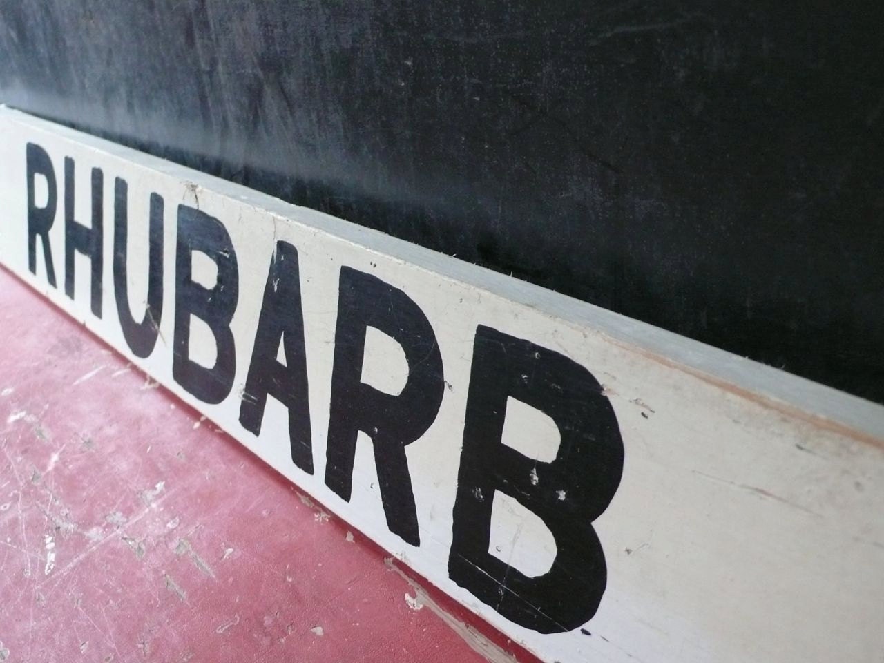 Vintage Wood Road side produce sign. Rhubarb