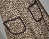 Christmas half apron with gingerbread men and candy cane print in brown and tan