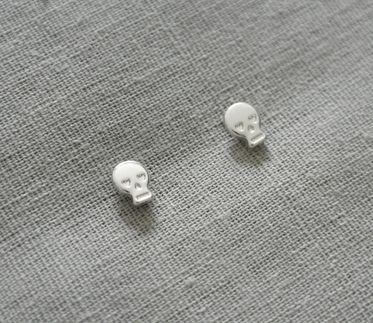 Make a wish silver plated tiny skull earrings