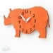 The "Rotund Rhino in Orange" designer wall mounted clock from LeLuni