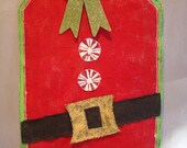 Santa gift tag hand painted burlap door/wall hanging in christmas red and embellished with burlap belt, candy buttons and glitter bow