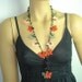 Crocheted necklace oya flower with onyx stones red green pink