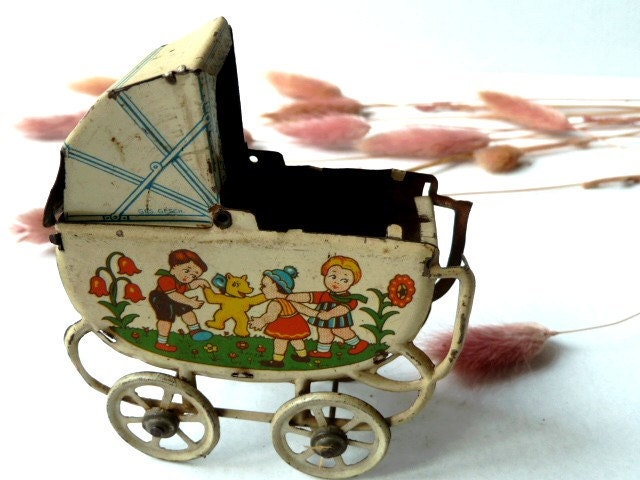 Antique french doll baby cradle .  Tin Baby Carriage .Toy .1900s