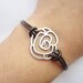 Bracelet---antique silver hollow-out rose&brown leather chain